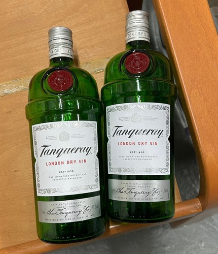 Two tanqueray gin bottles - two,