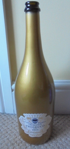 Empty gold coloured prosecco - gold,